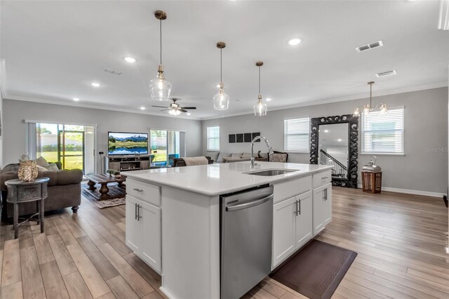 kitchen with visible vents, a sink, dishwasher, and open floor plan