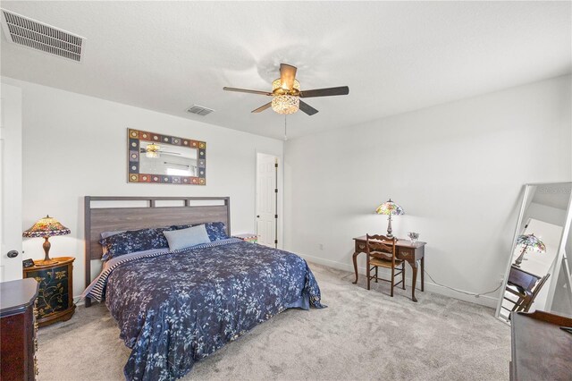 7322 34th Ct E, Sarasota, FL 34243 - carpeted bedroom with baseboards and ceiling fan