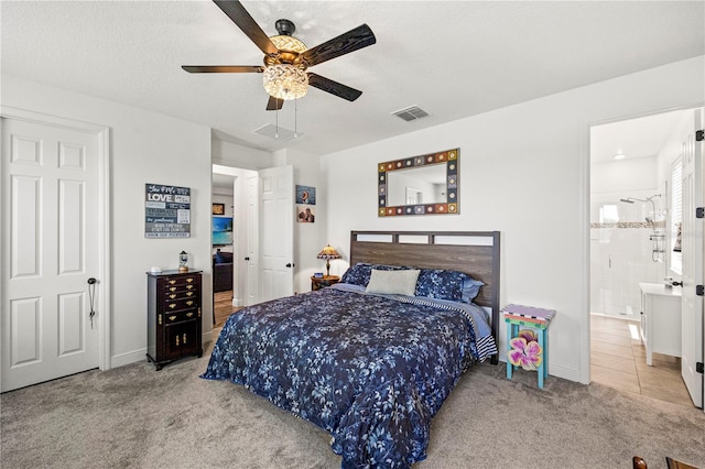 7322 34th Ct E, Sarasota, FL 34243 - bedroom with carpet floors, baseboards, a ceiling fan, and a textured ceiling