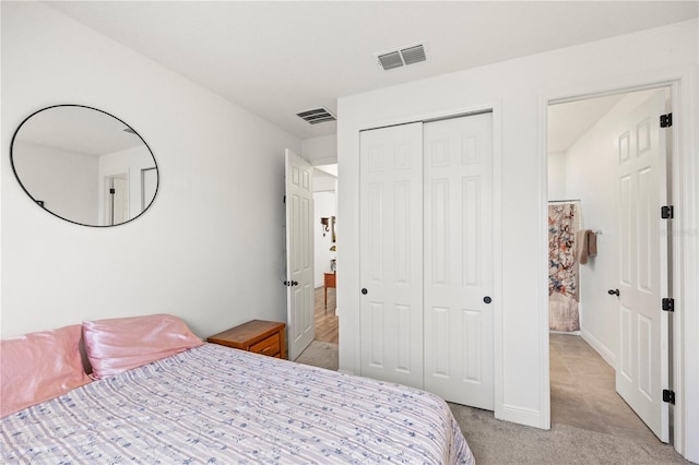 7322 34th Ct E, Sarasota, FL 34243 - bedroom with light carpet and a closet