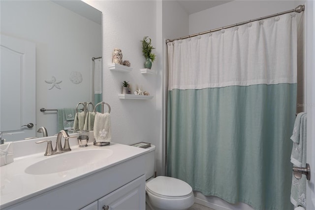 bathroom with toilet and vanity