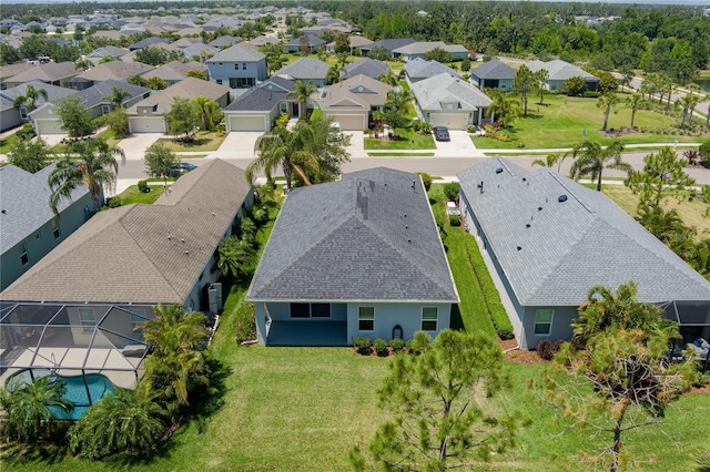 birds eye view of property with a residential view