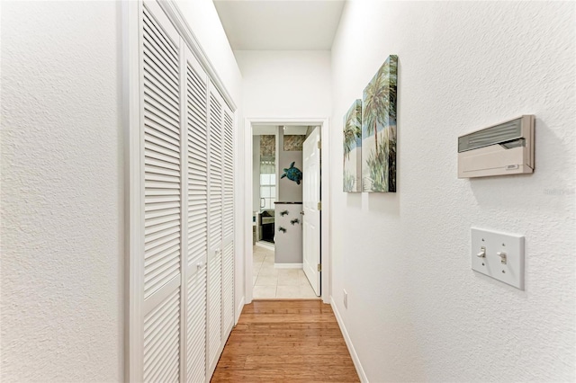 corridor with wood finished floors