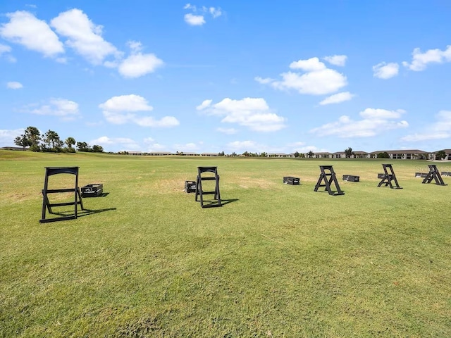 surrounding community with a yard