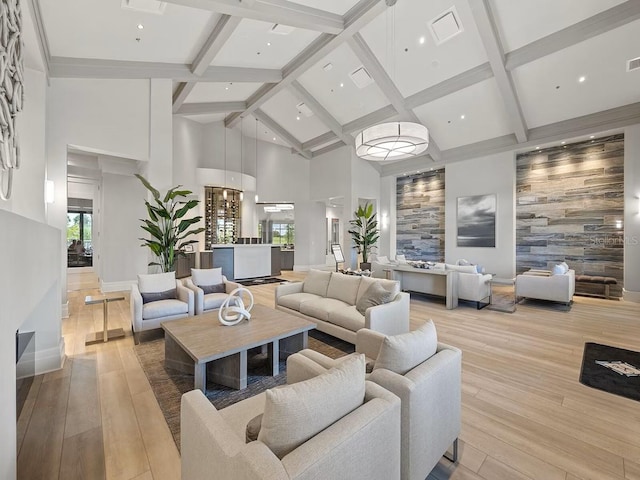 common area featuring beam ceiling and high vaulted ceiling