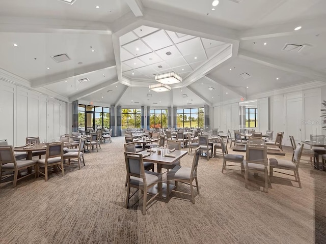 dining room with light colored carpet, high vaulted ceiling, recessed lighting, and beamed ceiling