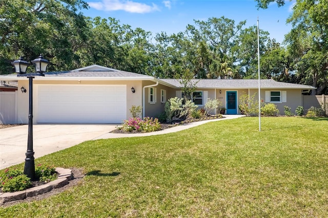 ranch-style home with a garage, driveway, fence, a front yard, and stucco siding