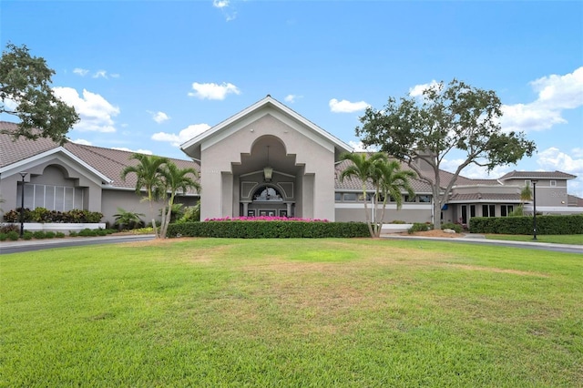 view of front of property featuring a front yard and stucco siding