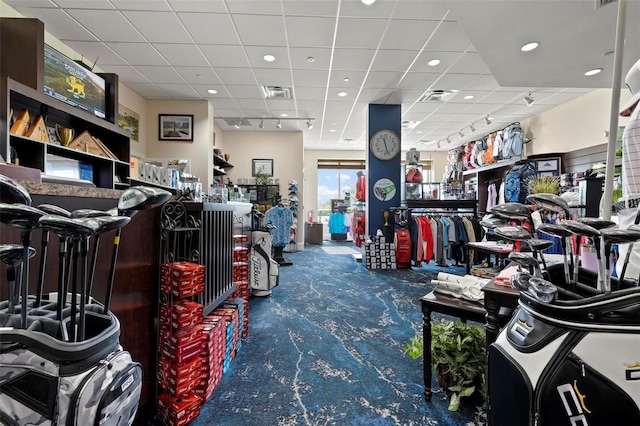 miscellaneous room featuring carpet floors, a paneled ceiling, and visible vents