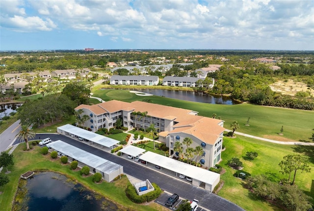 aerial view with view of golf course and a water view