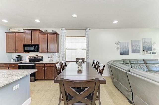 dining room featuring recessed lighting and light tile patterned floors