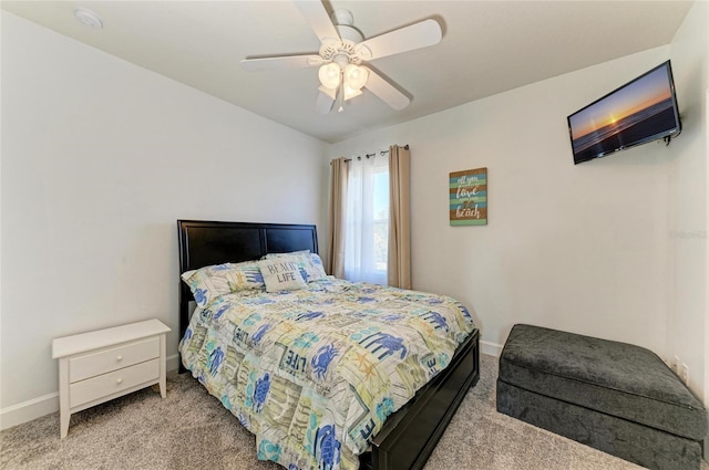 bedroom with baseboards, carpet, and a ceiling fan