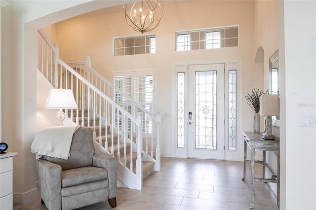 5502 Tidewater Preserve Blvd, Bradenton, FL 34208 - entrance foyer with stairs, arched walkways, a towering ceiling, and plenty of natural light