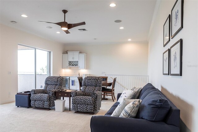 5502 Tidewater Preserve Blvd, Bradenton, FL 34208 - living area featuring crown molding, light colored carpet, ceiling fan, recessed lighting, and wet bar