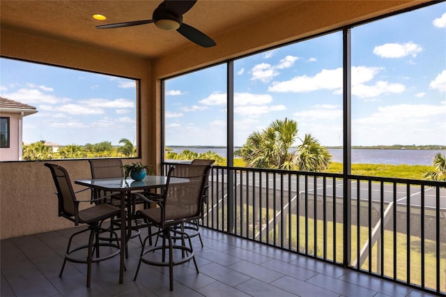 5502 Tidewater Preserve Blvd, Bradenton, FL 34208 - sunroom with a water view and tile patterned flooring