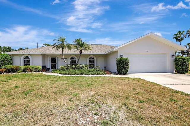 519 Bayview Ave, Osprey, FL 34229 - ranch-style house featuring concrete driveway, an attached garage, a front lawn, and stucco siding