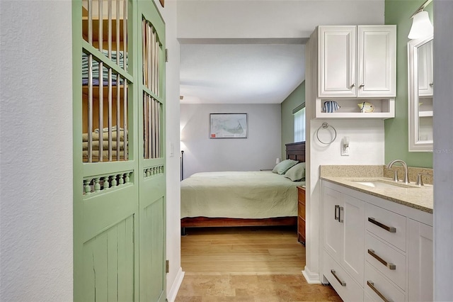519 Bayview Ave, Osprey, FL 34229 - bedroom featuring a sink and light wood finished floors