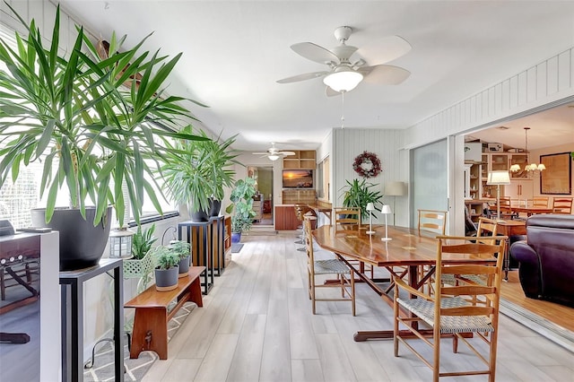 519 Bayview Ave, Osprey, FL 34229 - dining area with ceiling fan and light wood-type flooring