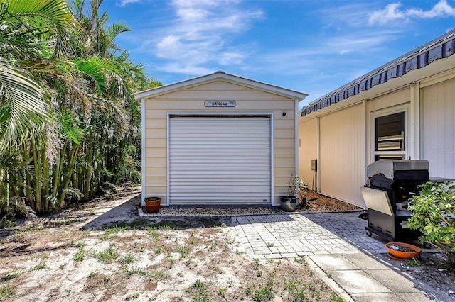 519 Bayview Ave, Osprey, FL 34229 - garage featuring a shed