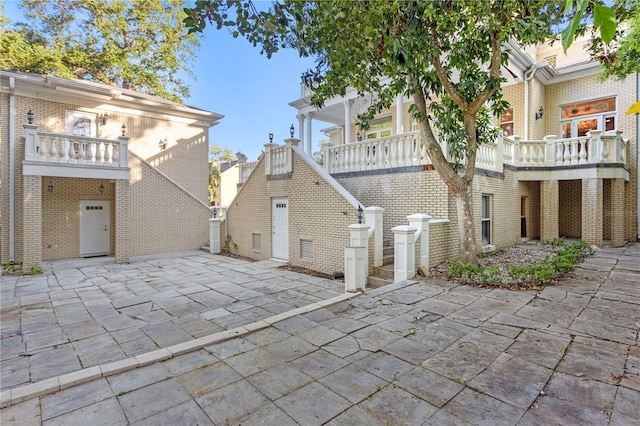 view of patio with a balcony