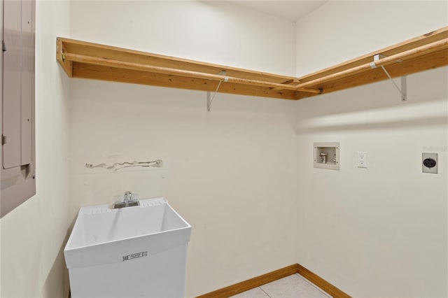 laundry room with hookup for an electric dryer, a sink, laundry area, hookup for a washing machine, and tile patterned flooring