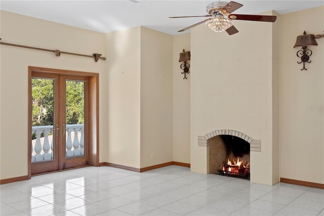 unfurnished living room with baseboards, light tile patterned floors, ceiling fan, and french doors