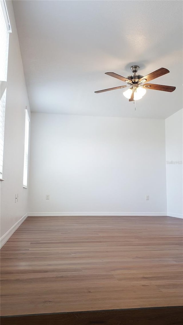 215 63rd Dr E, Bradenton, FL 34203 - unfurnished room with ceiling fan, wood finished floors, and baseboards