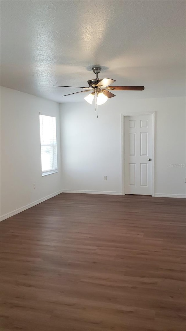 215 63rd Dr E, Bradenton, FL 34203 - unfurnished room with a textured ceiling, baseboards, a ceiling fan, and wood finished floors