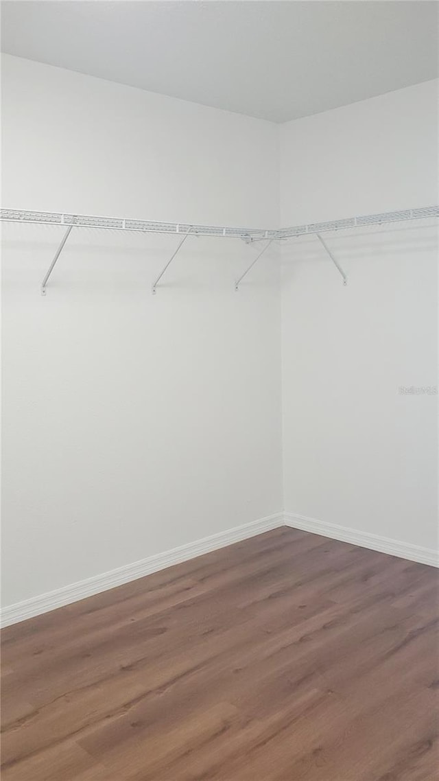 215 63rd Dr E, Bradenton, FL 34203 - walk in closet featuring wood finished floors