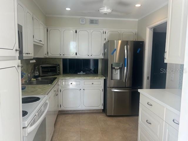 7461 W Country Club Dr N Unit 201, Sarasota, FL 34243 - kitchen featuring stainless steel refrigerator with ice dispenser, electric stove, crown molding, white cabinetry, and light tile patterned flooring