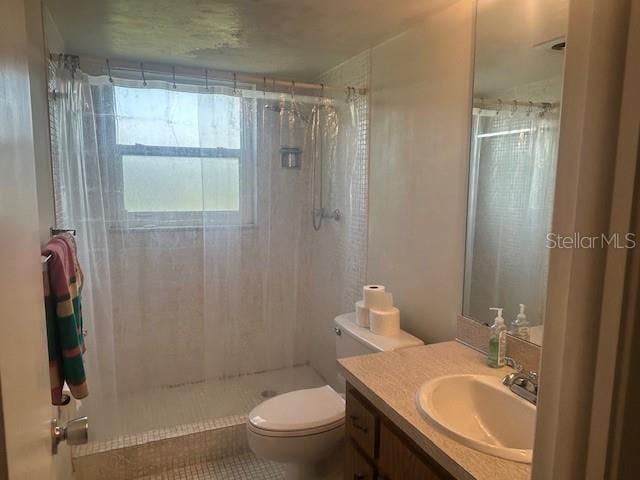 7461 W Country Club Dr N Unit 201, Sarasota, FL 34243 - full bathroom featuring toilet, vanity, and a shower with shower curtain