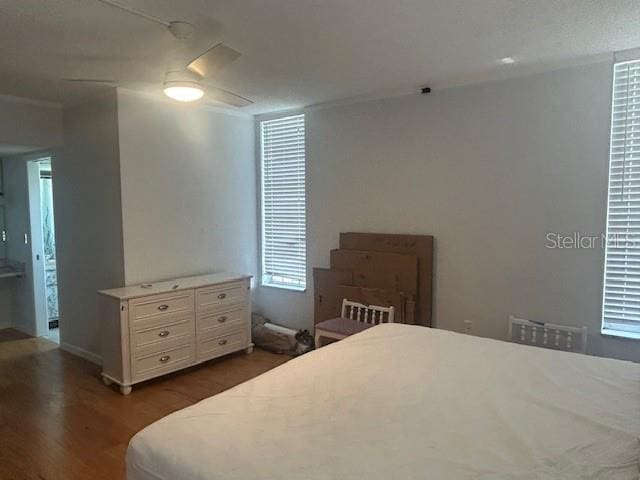 7461 W Country Club Dr N Unit 201, Sarasota, FL 34243 - bedroom featuring dark wood-style floors and ceiling fan