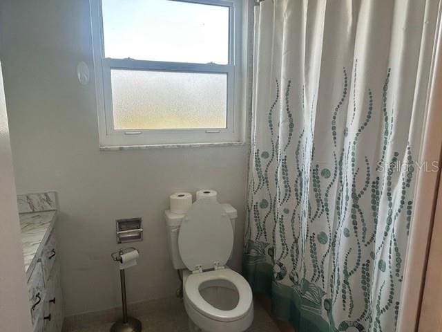 7461 W Country Club Dr N Unit 201, Sarasota, FL 34243 - full bathroom with toilet, vanity, and a shower with shower curtain