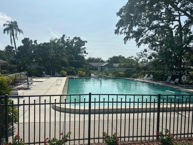 7461 W Country Club Dr N Unit 201, Sarasota, FL 34243 - community pool featuring a patio