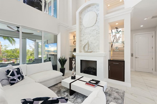 7118 Hawks Harbor Cir, Bradenton, FL 34207 - living room with recessed lighting, a ceiling fan, marble finish floor, and a fireplace