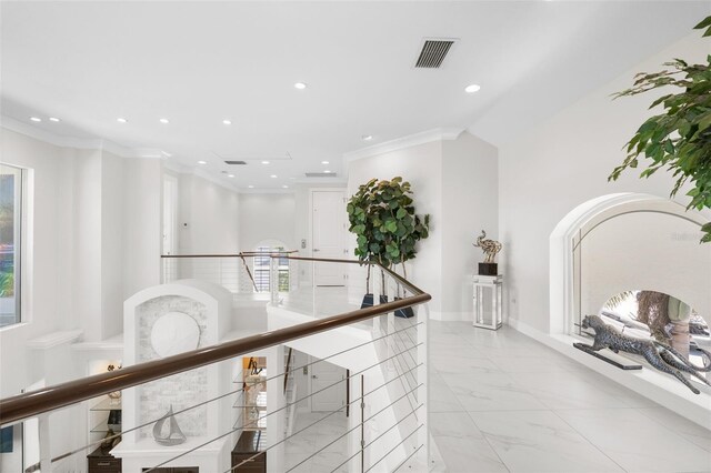 7118 Hawks Harbor Cir, Bradenton, FL 34207 - hall with ornamental molding, an upstairs landing, recessed lighting, and visible vents