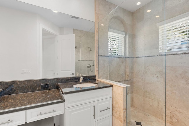 7118 Hawks Harbor Cir, Bradenton, FL 34207 - full bath featuring vanity, a tile shower, and recessed lighting