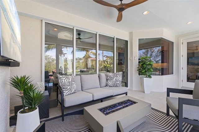 7118 Hawks Harbor Cir, Bradenton, FL 34207 - sunroom / solarium featuring a ceiling fan and an outdoor living space with a fire pit