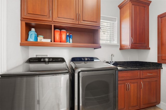 7118 Hawks Harbor Cir, Bradenton, FL 34207 - washroom featuring a sink, cabinet space, and washer and dryer
