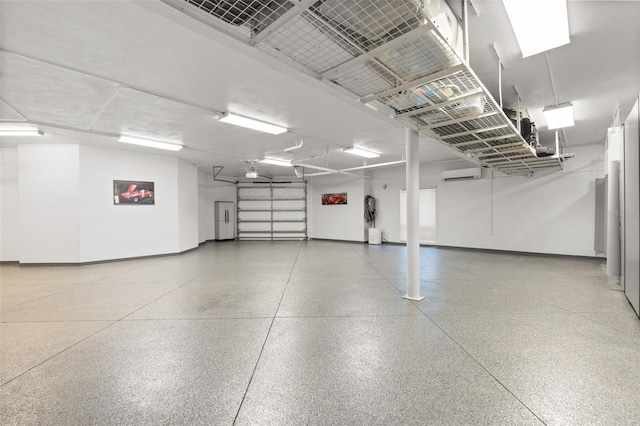 7118 Hawks Harbor Cir, Bradenton, FL 34207 - garage featuring an AC wall unit and baseboards