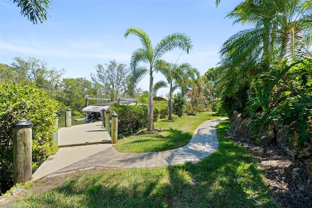 7118 Hawks Harbor Cir, Bradenton, FL 34207 - view of home's community with a lawn and a boat dock