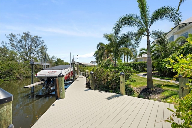 7118 Hawks Harbor Cir, Bradenton, FL 34207 - view of dock featuring boat lift and a water view