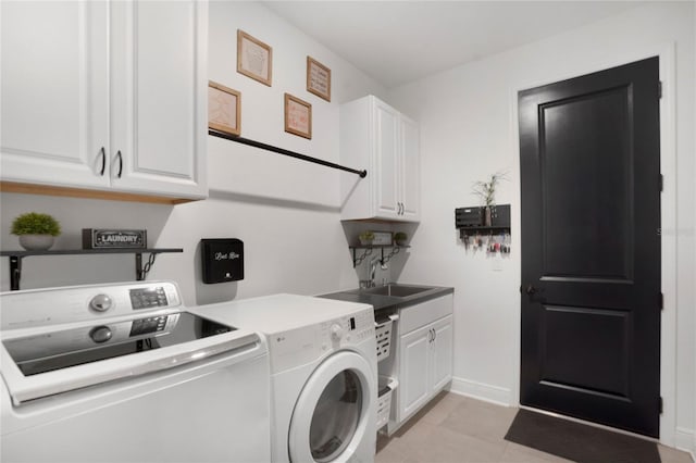 14514 20th St E, Parrish, FL 34219 - washroom featuring separate washer and dryer, a sink, cabinet space, and baseboards