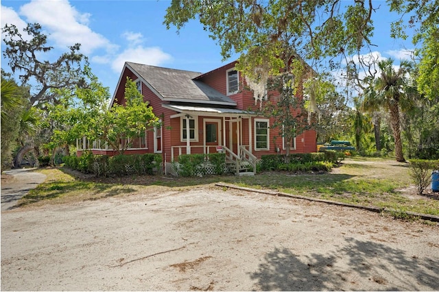 14514 20th St E, Parrish, FL 34219 - exterior space with a porch and roof with shingles