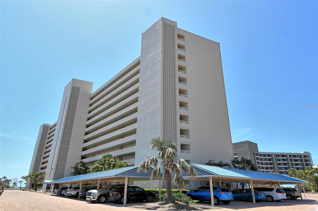 5920 Midnight Pass Rd Unit 406, Sarasota, FL 34242 - view of building exterior with covered parking