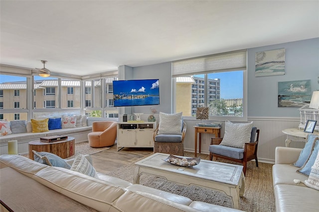 5920 Midnight Pass Rd Unit 406, Sarasota, FL 34242 - living area with a wainscoted wall, wood finished floors, and a ceiling fan