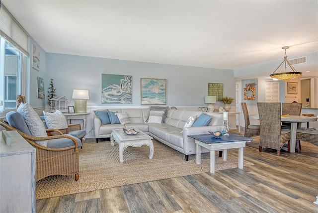 5920 Midnight Pass Rd Unit 406, Sarasota, FL 34242 - living room with wood finished floors and a wainscoted wall