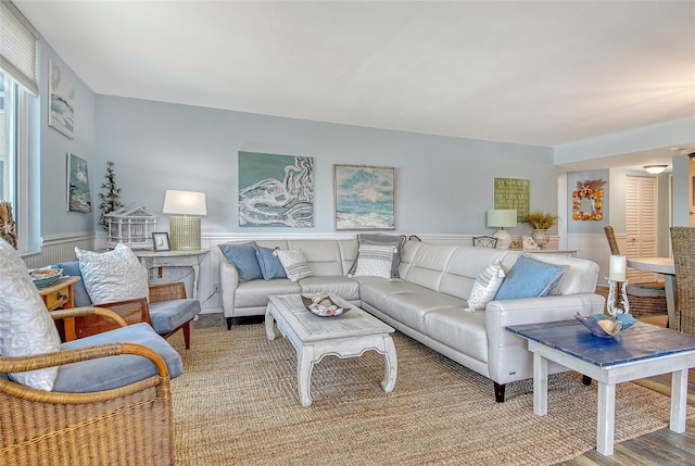 5920 Midnight Pass Rd Unit 406, Sarasota, FL 34242 - living room featuring a wainscoted wall and light wood-style flooring