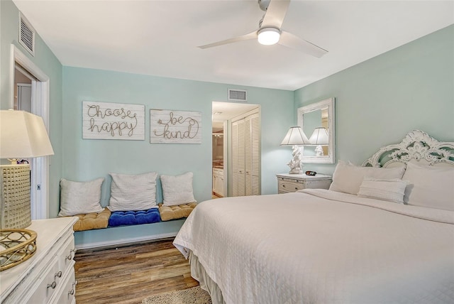 5920 Midnight Pass Rd Unit 406, Sarasota, FL 34242 - bedroom with dark wood finished floors, a closet, and ceiling fan