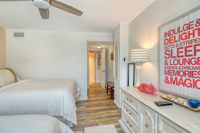 5920 Midnight Pass Rd Unit 406, Sarasota, FL 34242 - bedroom featuring wood finished floors, baseboards, and a ceiling fan